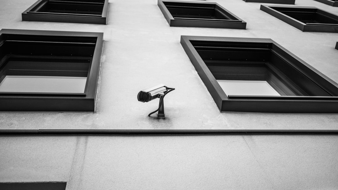 Close up of a security camera on a city street.