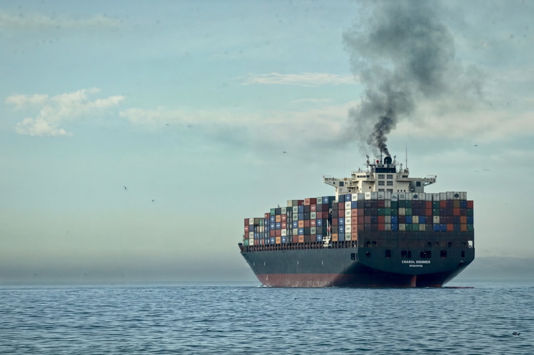 Container ship at sea showing signs of conflict