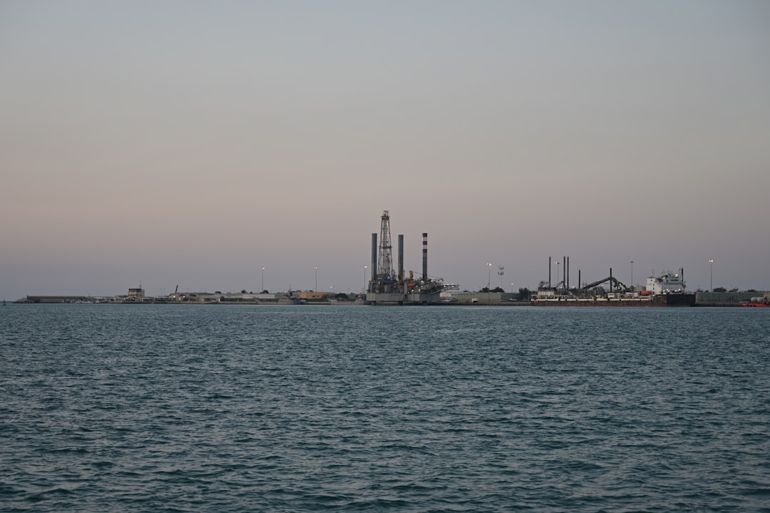 Industrial oil infrastructure silhouettes.