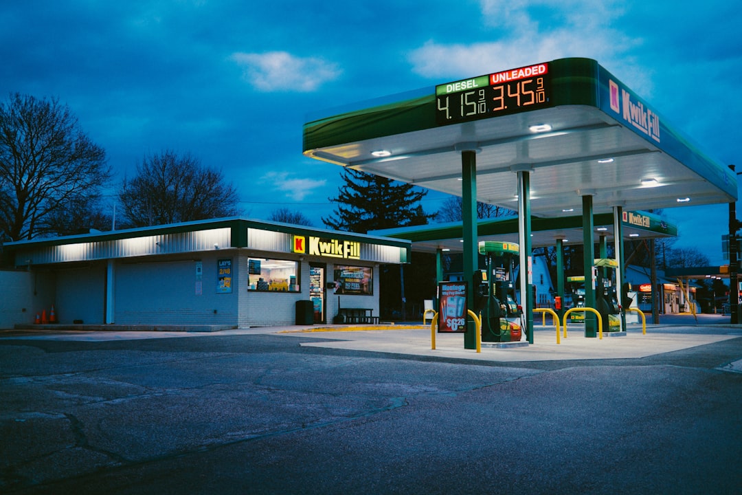 Gas station fuel pumps with prices visible