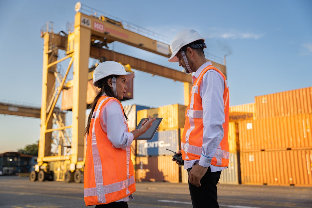 Cargo containers being inspected at port facility