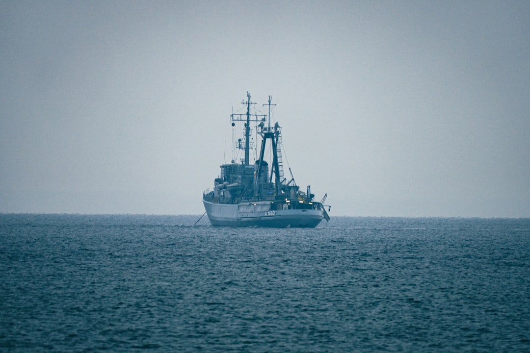 A naval patrol boat navigating open waters.
