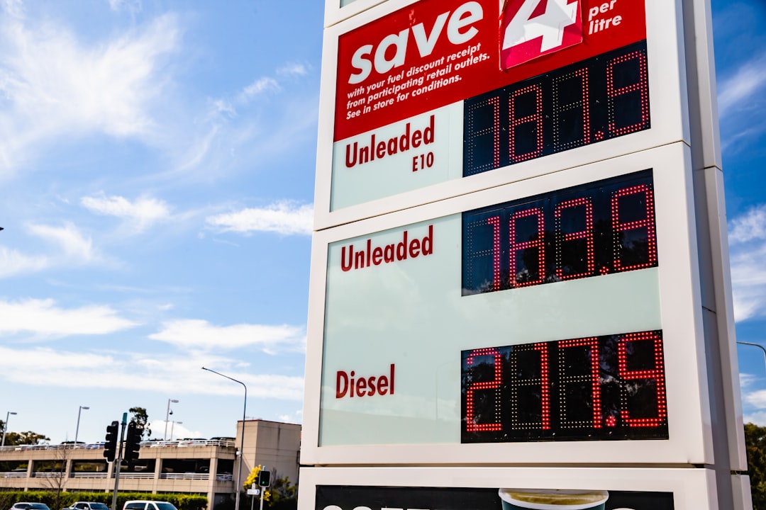 Close-up of a rising gas price sign at a petrol station.